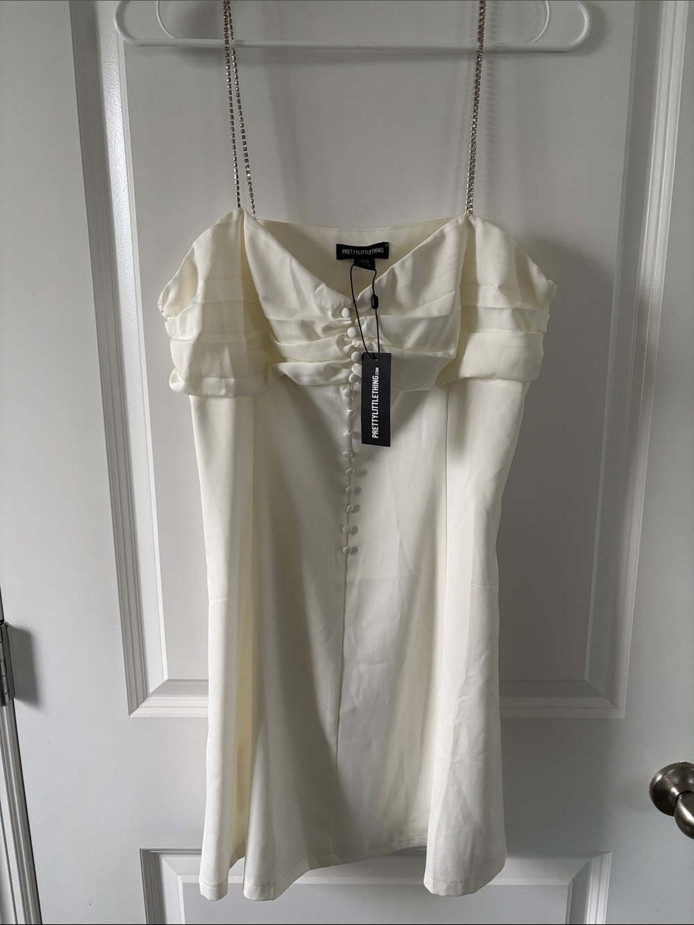 PrettyLittleThing Cream Off-Shoulder Satin Mini Dress with Button Trim